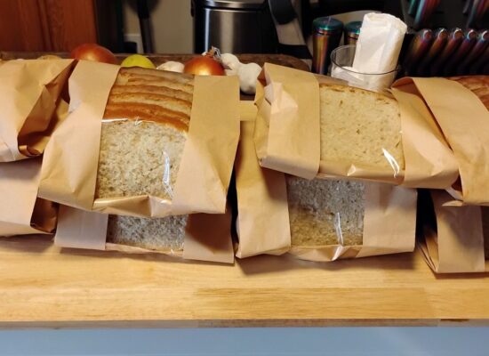packaged sourdough loaves sitting on a counter top