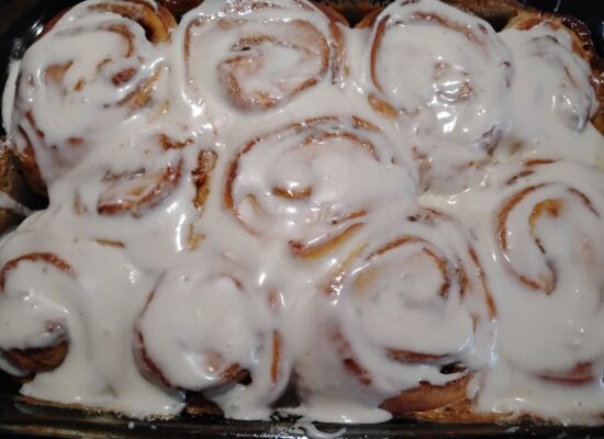 Cinnamon rolls covered in frosting made by 7 Loaves Bakery in Lexington NC.